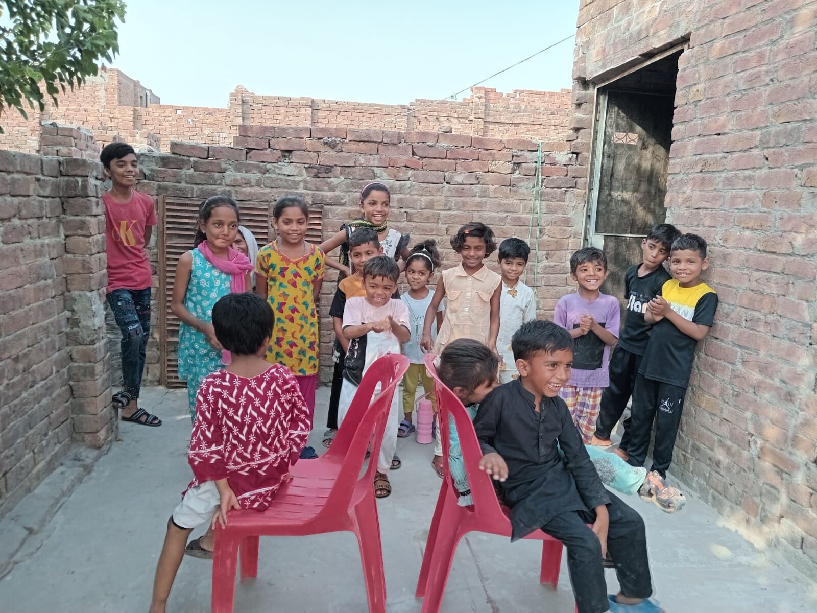 A joyful group of Meri Pehchan students together in Faisalabad